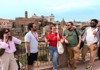 A group of tourists standing on the Palatine Hill with their guide from The Tour Guy.